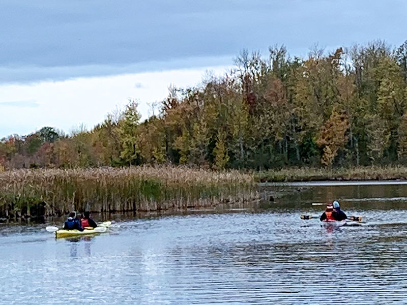 Image taken by Dawn Noble McCann of kayakers on a lake.