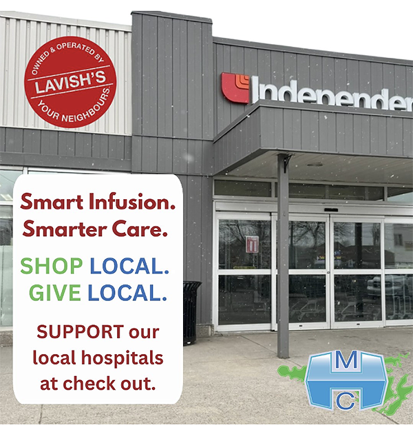 Image of the entrance to Lavish's Your Independent Grocers, with graphics to Shop Local. Give Local., etc.