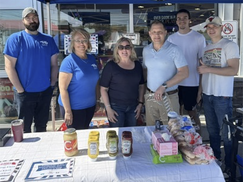 Image of Andrew Orr, owner of Mindemoya Foodland alongside staff and volunteers